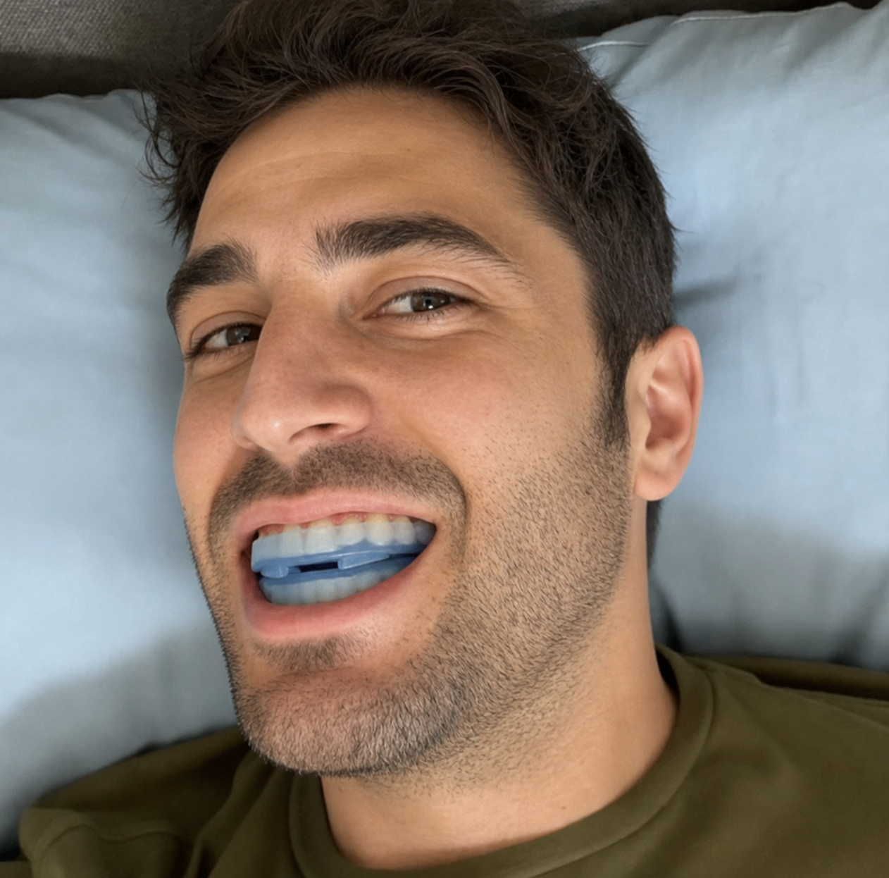Man sleeping peacefully wearing the mouthpiece